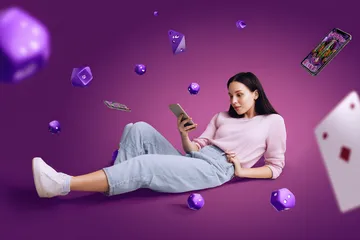A woman smiling by bright slot machines showing lucky symbols, showcasing the exciting slot offerings at JL29.